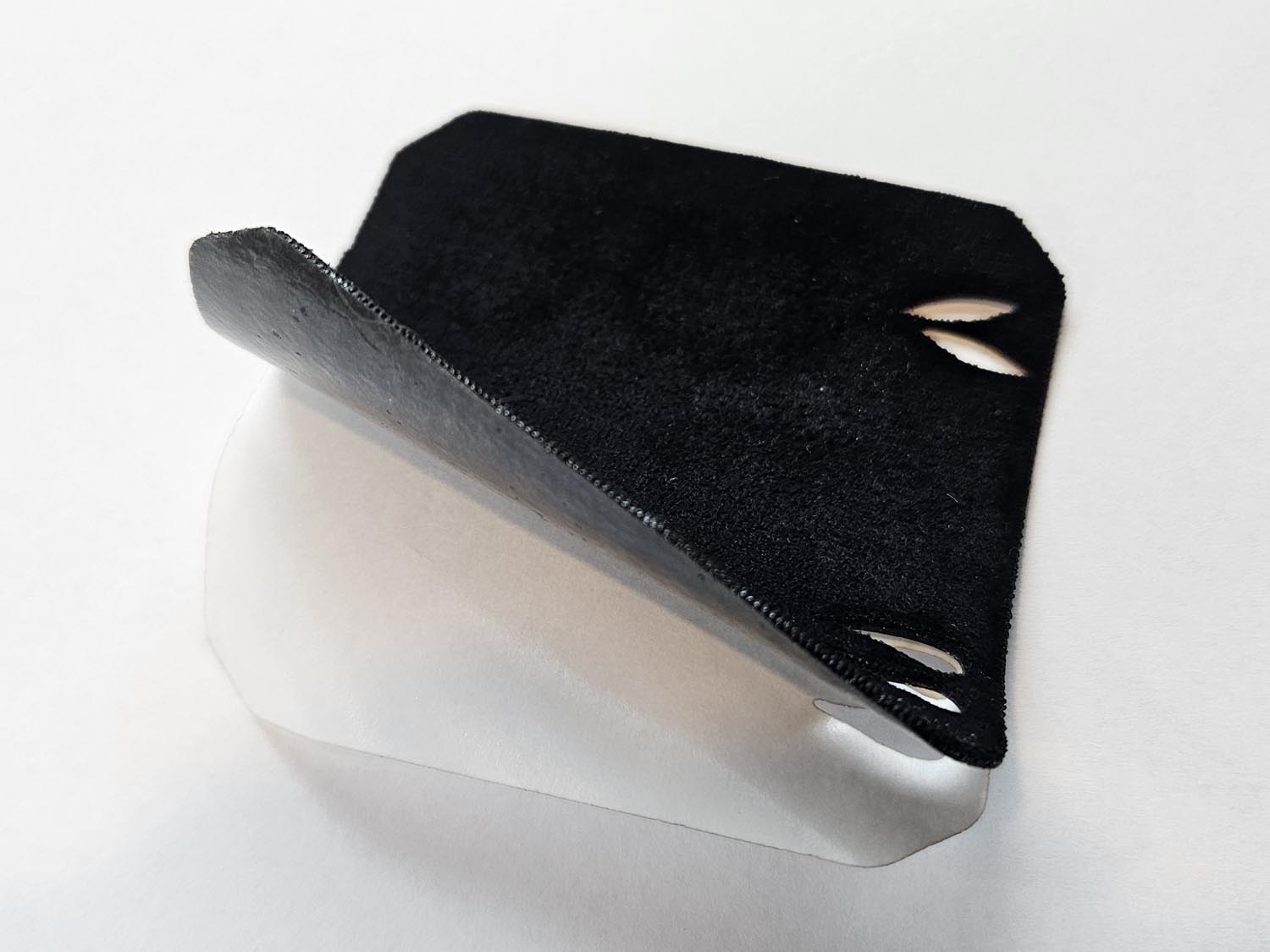 Black self-adhesive inlay